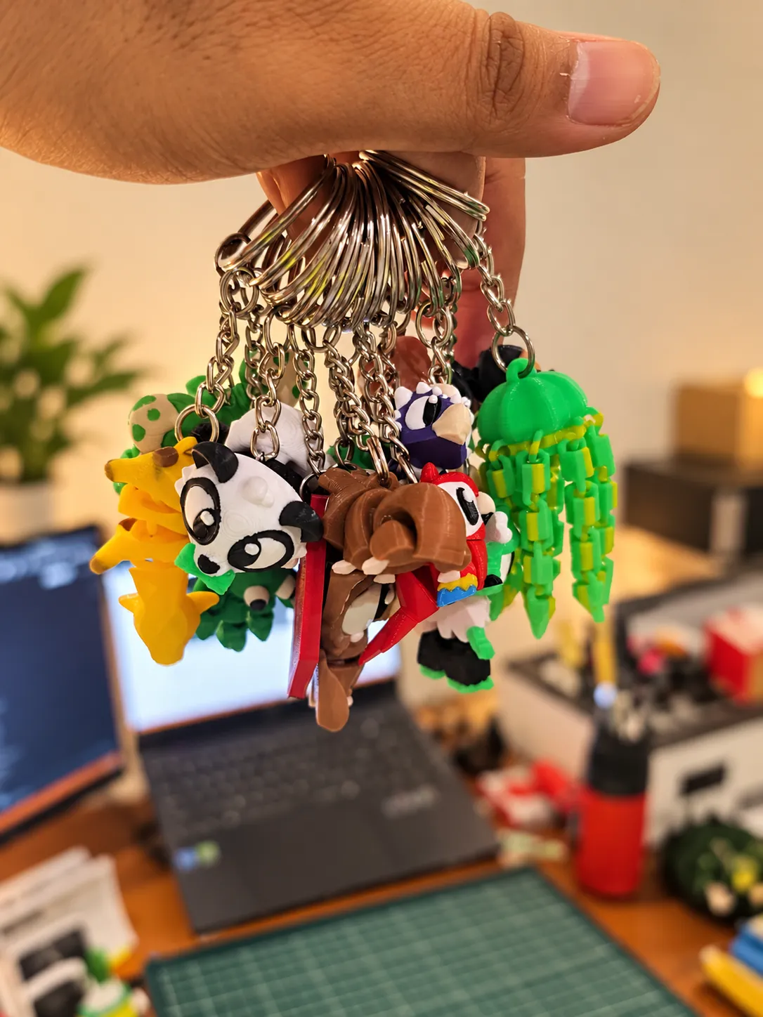 A pair of printed animal keychains on travertine
